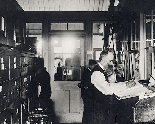 Staff working in silk mill office