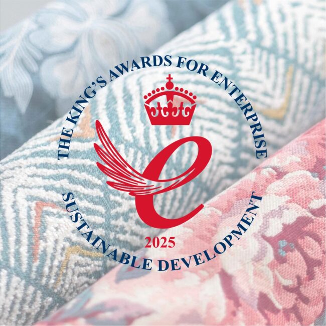 King's Award emblem on fabric background